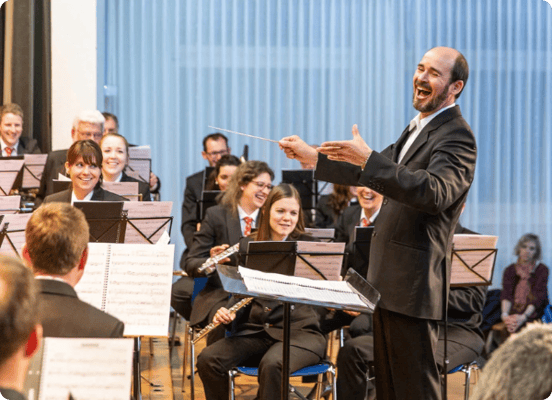 Neuenkirch Wind Orchestra performing at an event